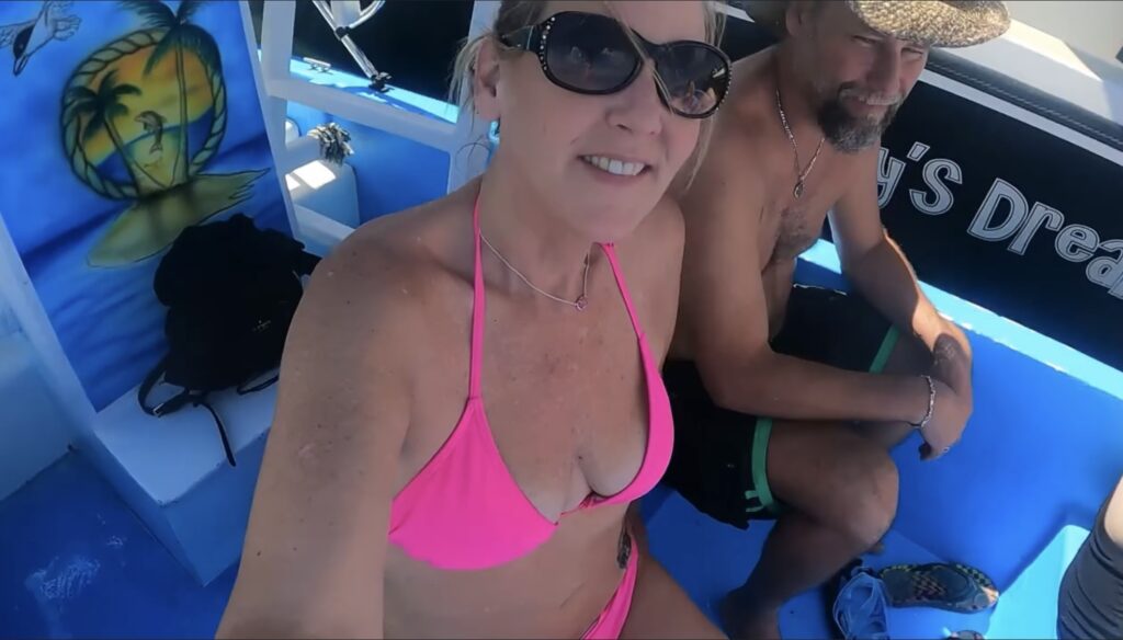 Tammy & Paul snorkeling in Honduras right Rose his her leg on some coral