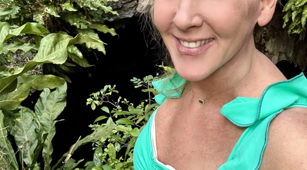 Tammy Rose standing in front of cenote in Cozumel, Mexico moments before 20 foot jump