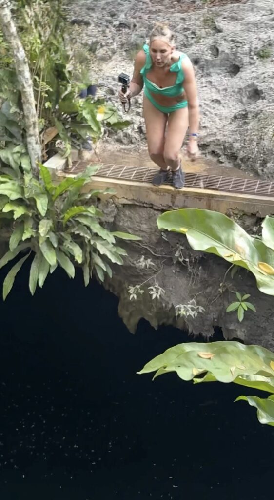 woman jumping 20 feet into cenote in Mexico adventure excursion