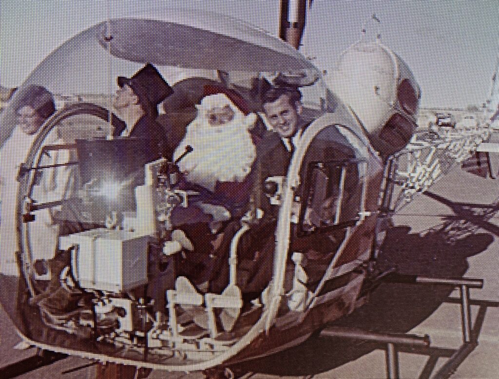 Jerry Foster helicopter reporter flying Santa Claus in a chopper during holiday news coverage