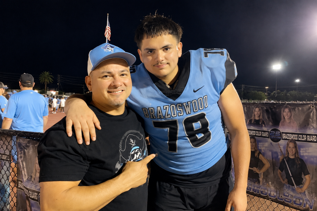 John Gabriel Mendoza Jr. pictured in a Brazoswood football uniform with a family member before his death in Lake Jackson.