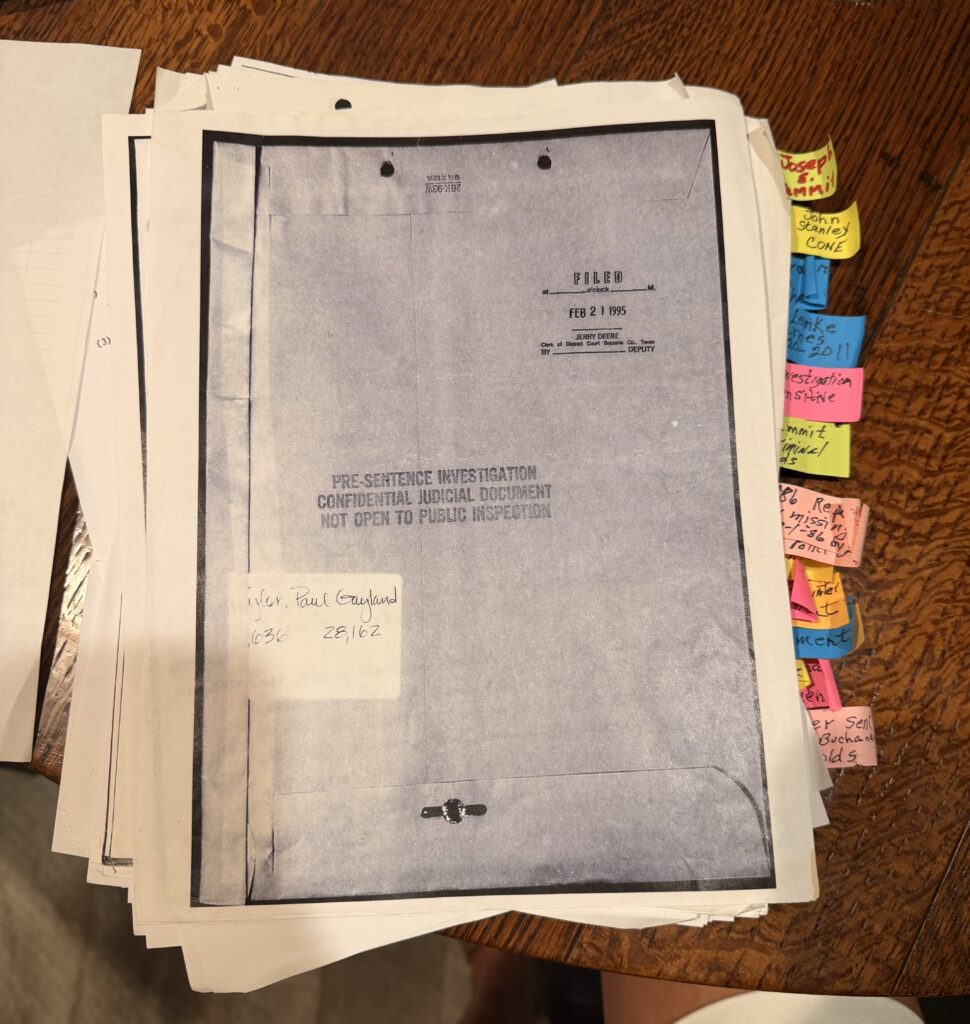 Collection of sealed court records, handwritten notes, and investigative documents marked with color-coded tabs reviewed by Rebecca Beard’s family during their examination of the case file.