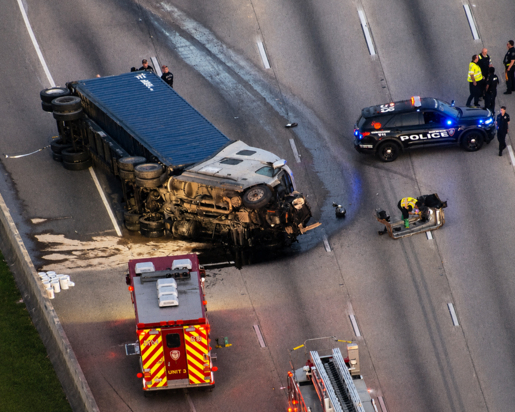 Overturned 18-wheeler and emergency crews at a deadly crash on Interstate 10 inbound near Highway 6 in west Houston.