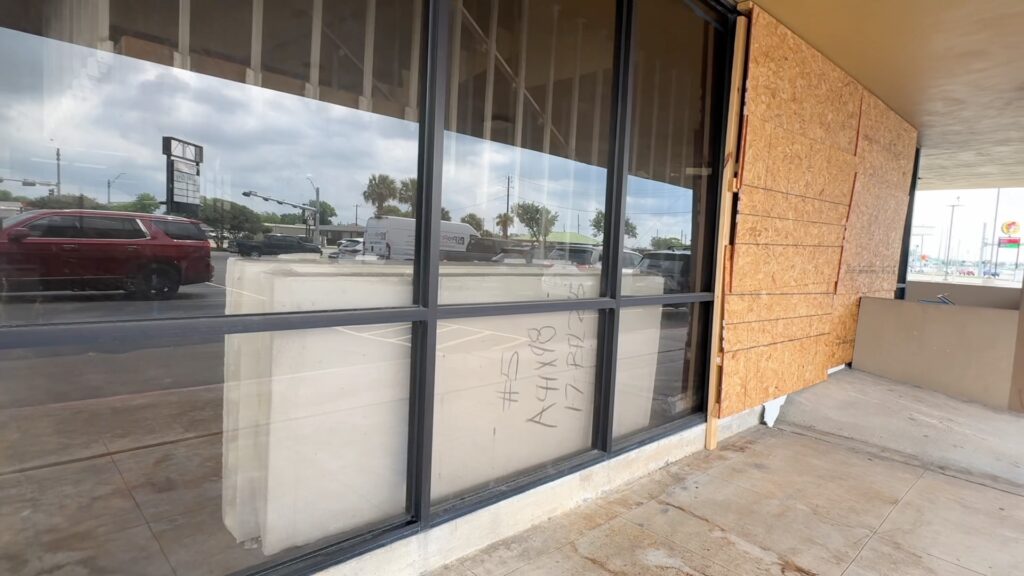 Present-day view of the former Excalibur Club building in Freeport, Texas, showing the storefront with boarded windows and the location where Rebecca Beard was last reported seen before her disappearance in 1986.