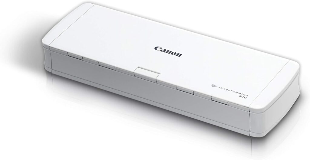 Portable Canon document scanner used to preserve case files, photographs and handwritten records.