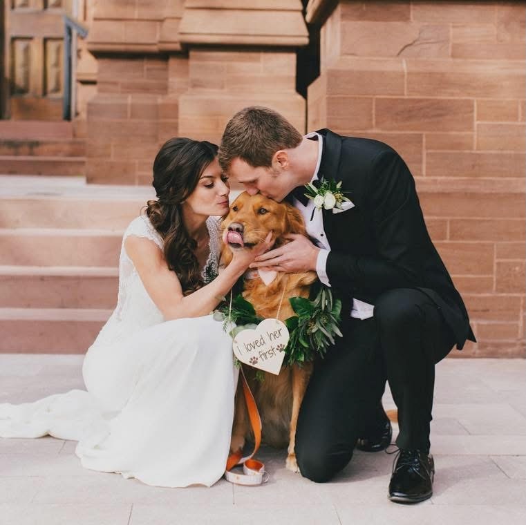 Christa Bauer Gilley and Lee Gilley with their dog on their wedding day