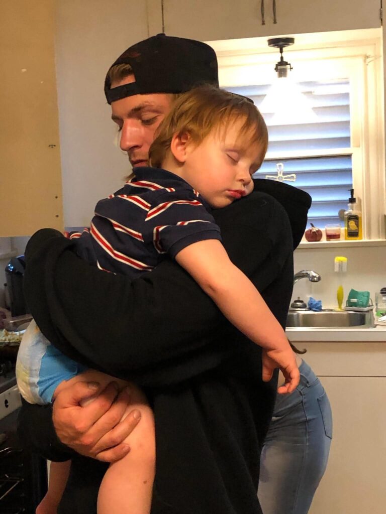 Patrick William Wright holding one of his young children before his death in Galveston