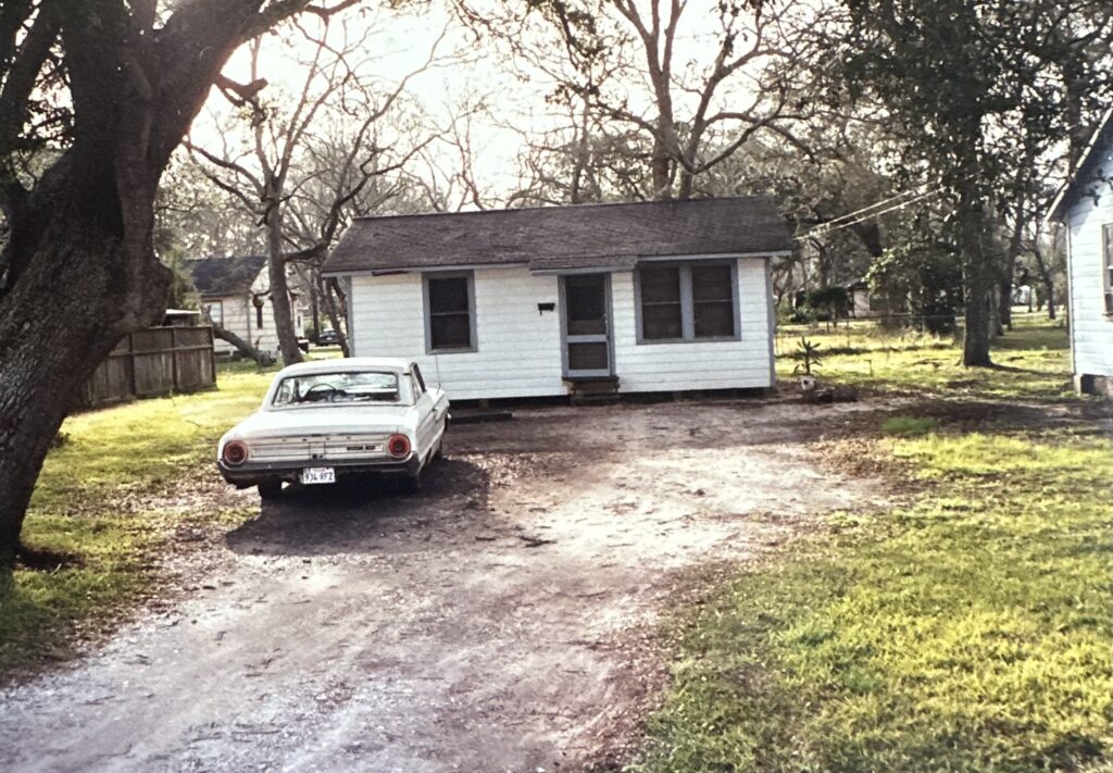 Front exterior of the home linked to the Becky Beard murder investigation in Clute, Texas, with a white car parked in the driveway.