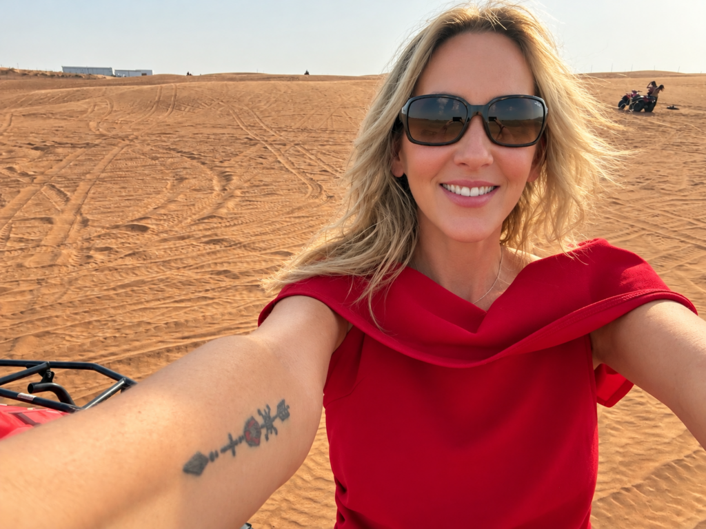 Investigative Reporter Tammy Rose enjoying a Dubai desert safari before sharing why travel medical insurance matters.