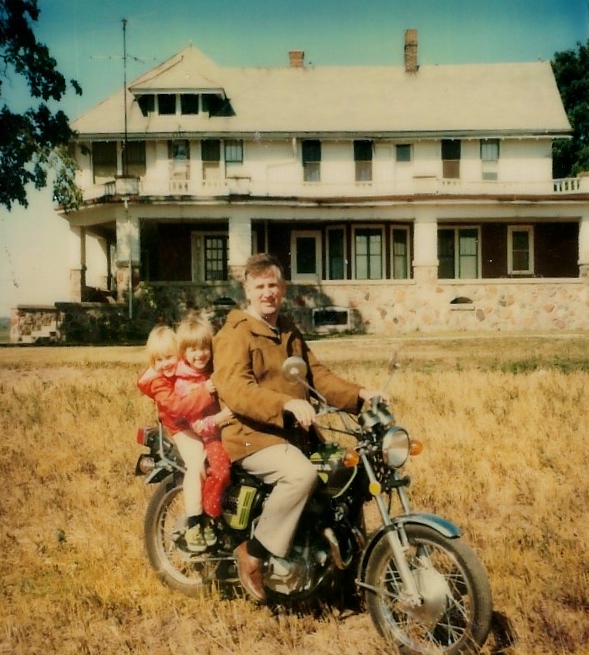 Childhood photo of Tammy Rose riding a motorcycle with her dad, who inspired her lifelong love of travel.